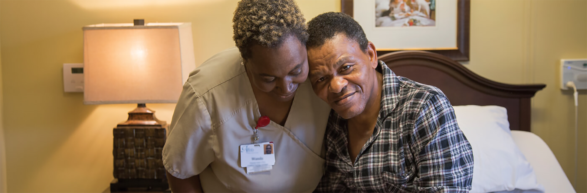 associate with arms around the shoulder of resident